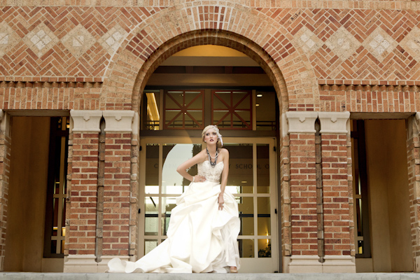 dramatic bride posing in front of school building - wedding photo by top Orange County, California wedding photographers D. Park Photography